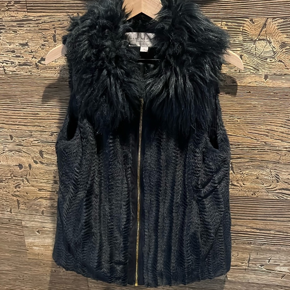 Like new! Navy blue faux fur zip vest.